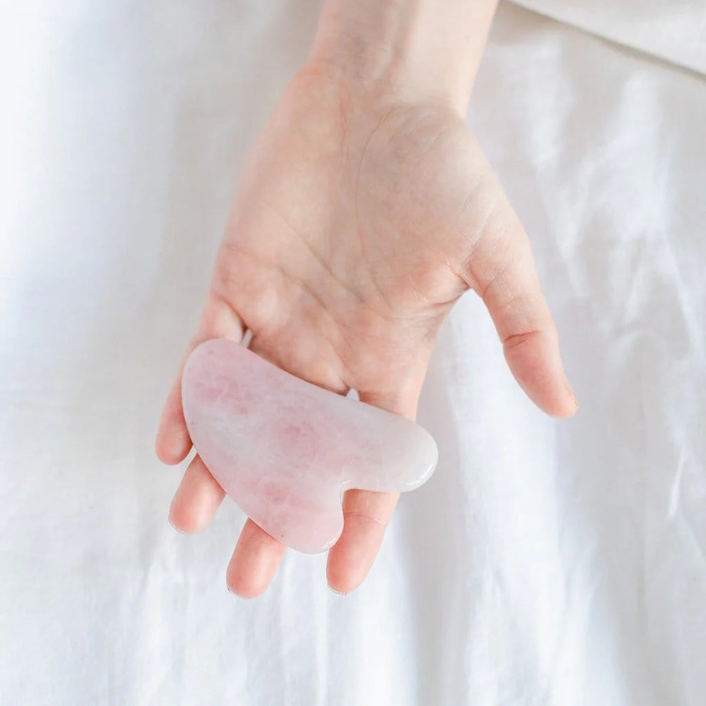 Experience the rejuvenating effects of facial contouring with our Rose Quartz Gua Sha tool, enhancing your natural beauty